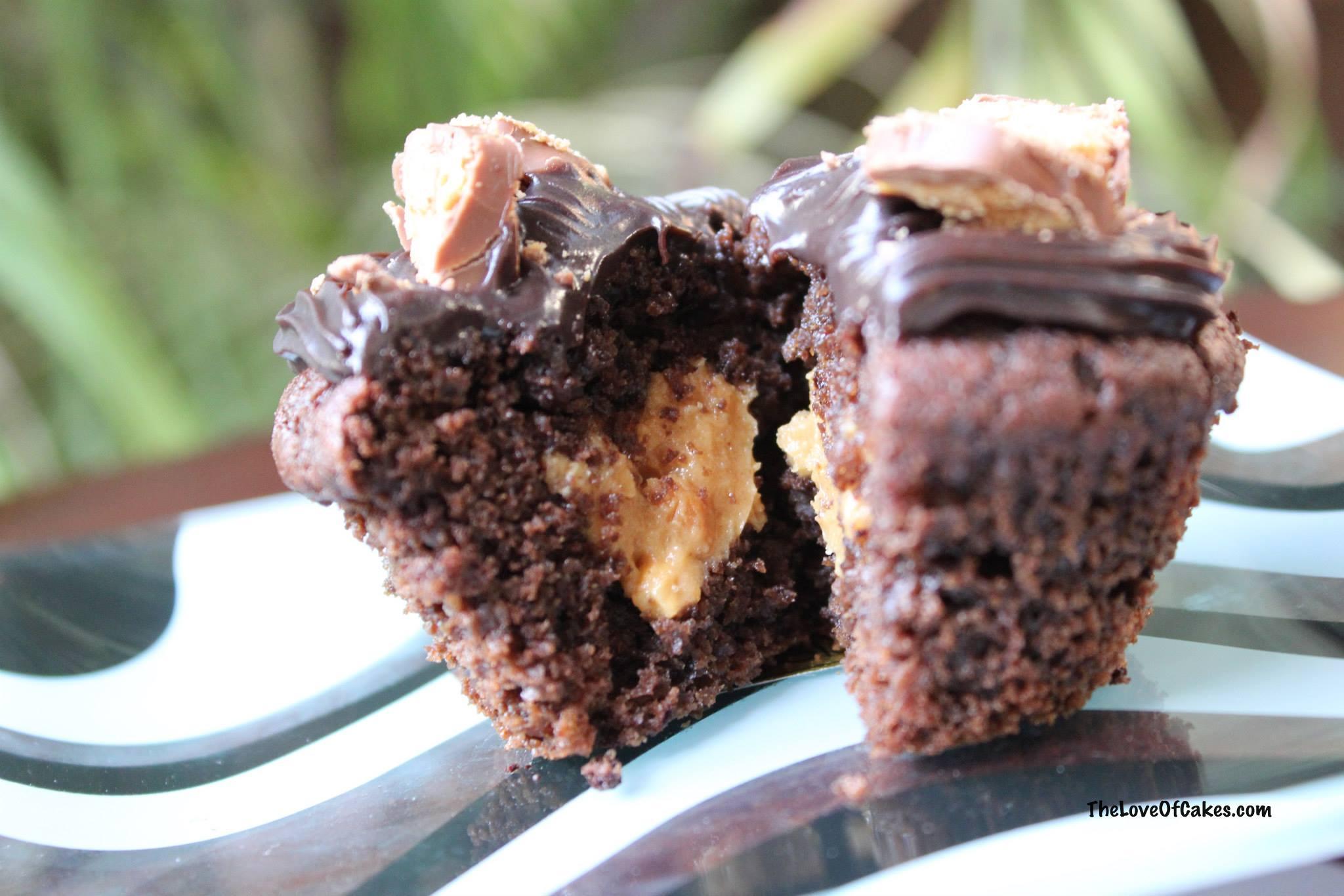 Chocolate cupcakes with peanut butter centers and chocolate icing