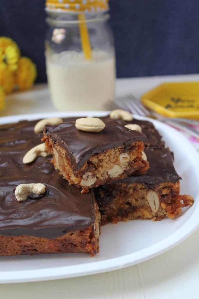 Butterscotch chips and cashew squares with chocolate glaze
