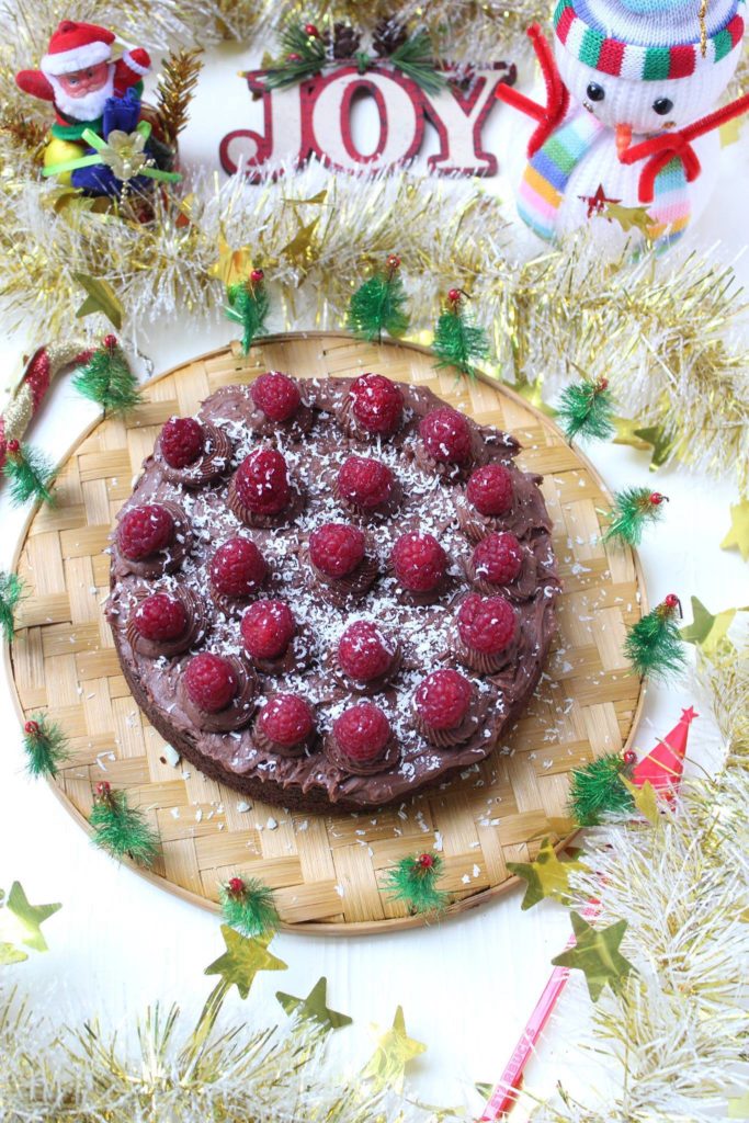 Rich dark chocolate cake with chocolate buttercream and fresh raspberries