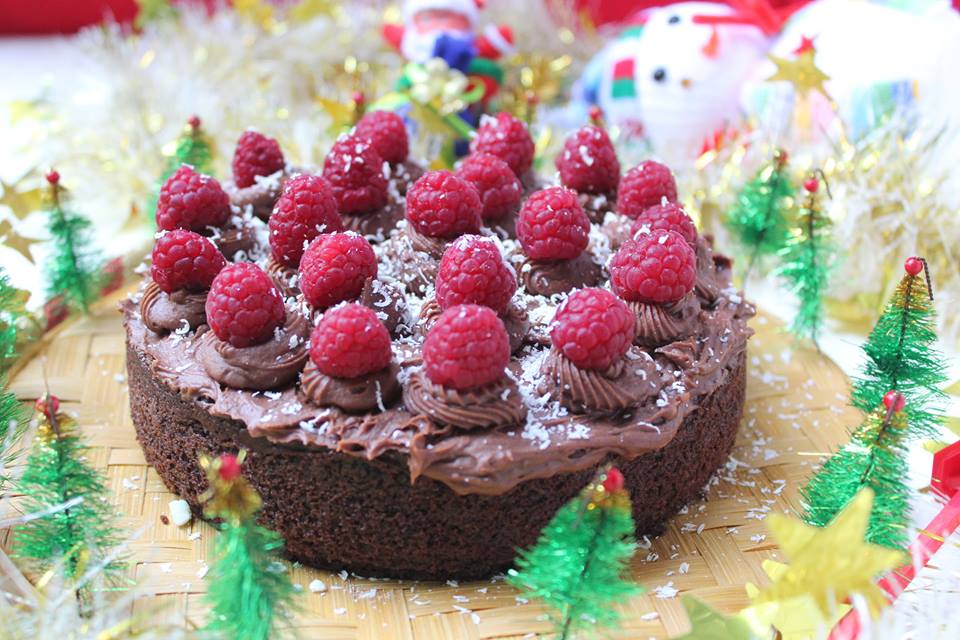 Rich dark chocolate cake with chocolate buttercream and fresh raspberries